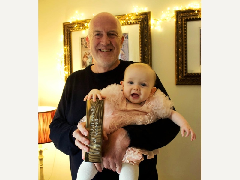 Mark Ferguson, More Fire PR, with his granddaughter Margot and winning trophy